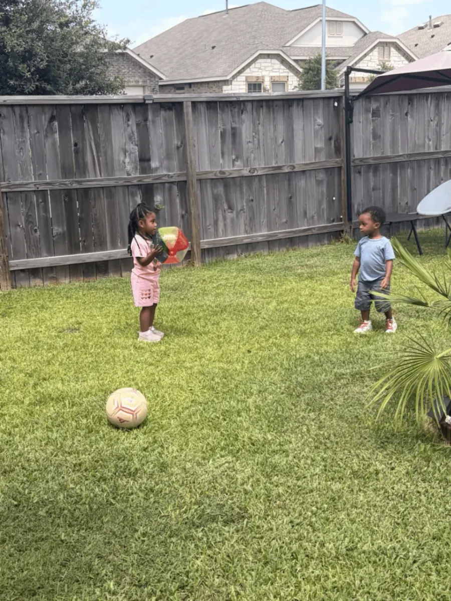 Preschool children counting and playing with balls outdoors